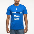 A person wearing a bright blue crewneck t-shirt with a white graphic print that reads 'I Gotrra Man MF!' with two drum icons replacing the 'r' in 'Gotrra'.
